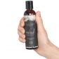 Intimate Earth Naked Hierontaöljy 120 ml tuote kädessä 50